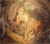 Mosaic boy catching a bird with a net